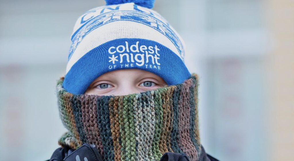 The Lighthouse Orillia is gearing up for the Coldest Night of the Year fundraiser, with a young boy dressed in hat and scarf getting ready to go outside