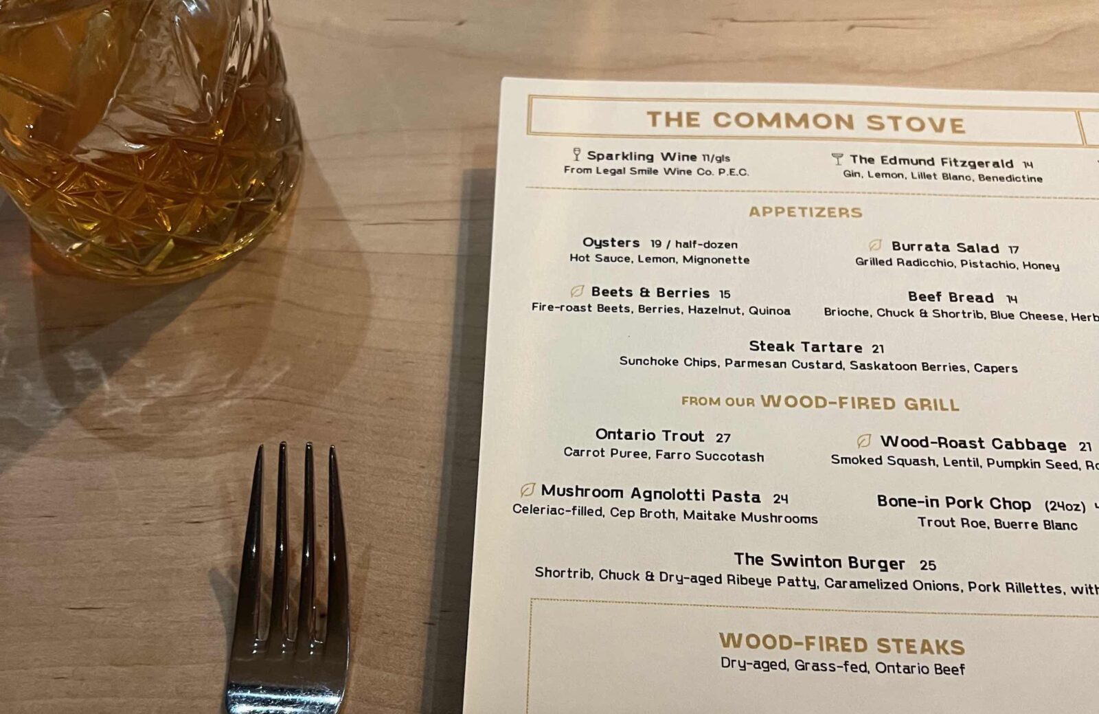 The Common Stove menu and fork and cocktail